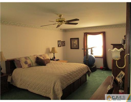 120 South Cliff Road Colonia, NJ 07067 - Photo 5 of 13 a bedroom with bed and window