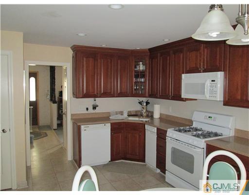 120 South Cliff Road Colonia, NJ 07067 - Photo 9 of 13 a utility room with sink dryer and washer