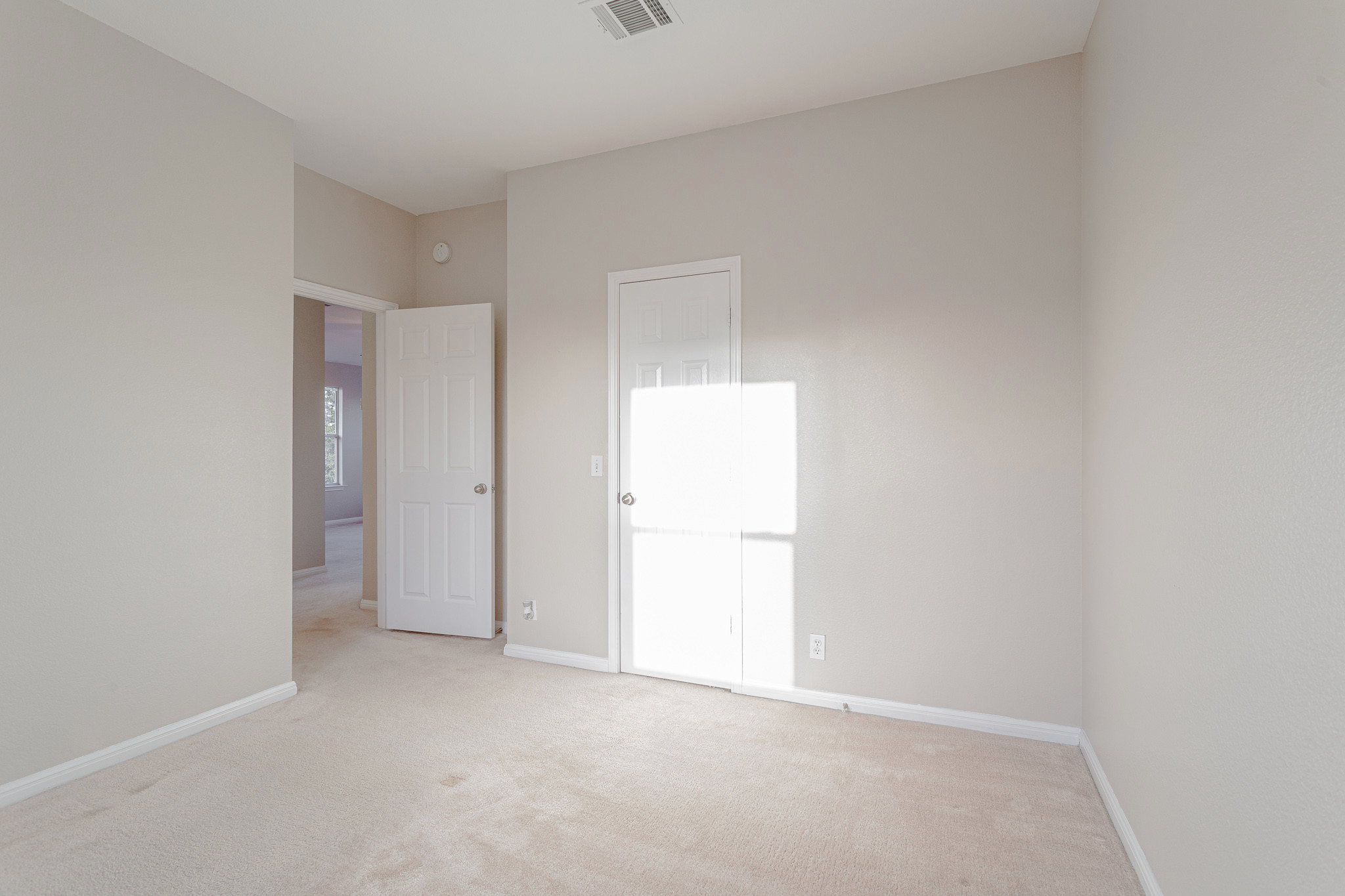 19201 Mangan Way Pflugerville, TX 78660 - Photo 17 of 29 Unfurnished bedroom featuring carpet floors and baseboards