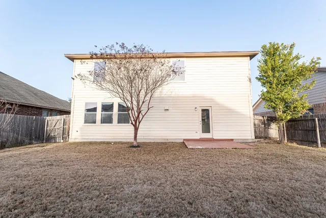 a house with trees in front of it