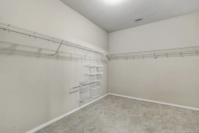 a view of a room with racks on the wall