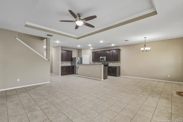 a view of a kitchen with a sink and stainless steel appliances