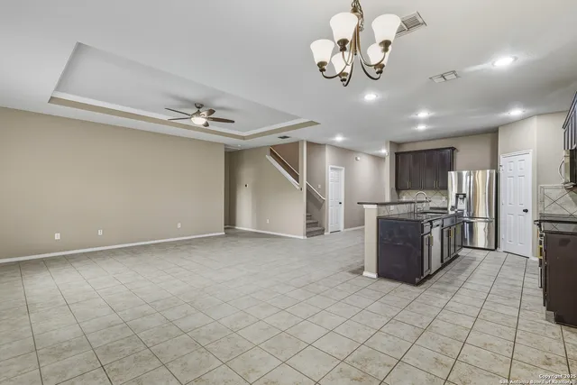 a view of a kitchen with windows