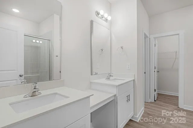 a bathroom with a shower and a window