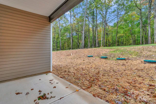 a backyard of a house with lots of green space