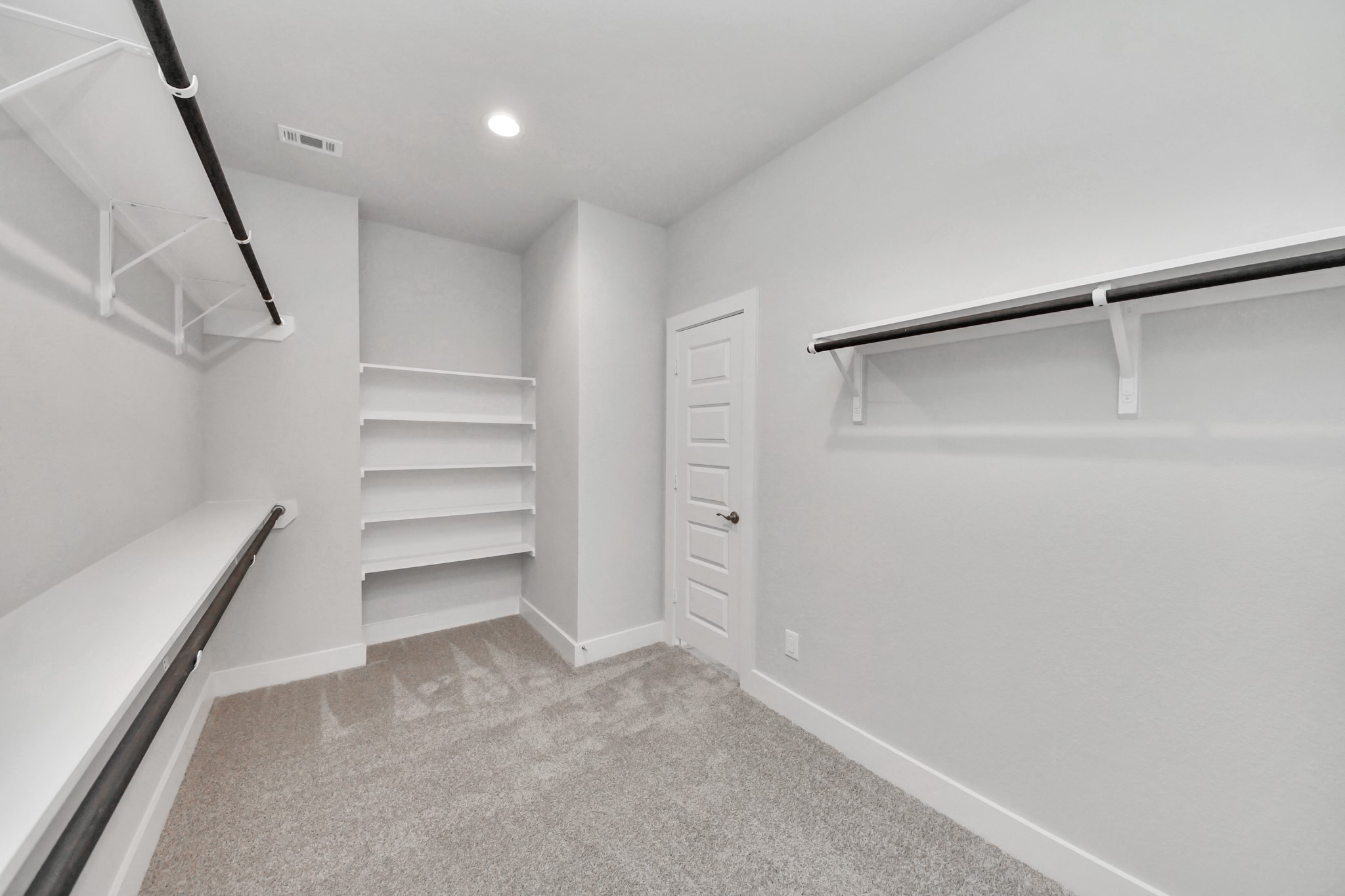 3110 Native Spg Drive Spring, TX 77373 - Photo 22 of 34 Walk-in closet that epitomizes luxury and practicality. This generously sized space features built-in shelving, offering abundant room for impeccable organization. High ceilings and recessed lighting create a bright and welcoming ambiance. Sample photo of completed home with similar floor plan. Actual colors and selections may vary.