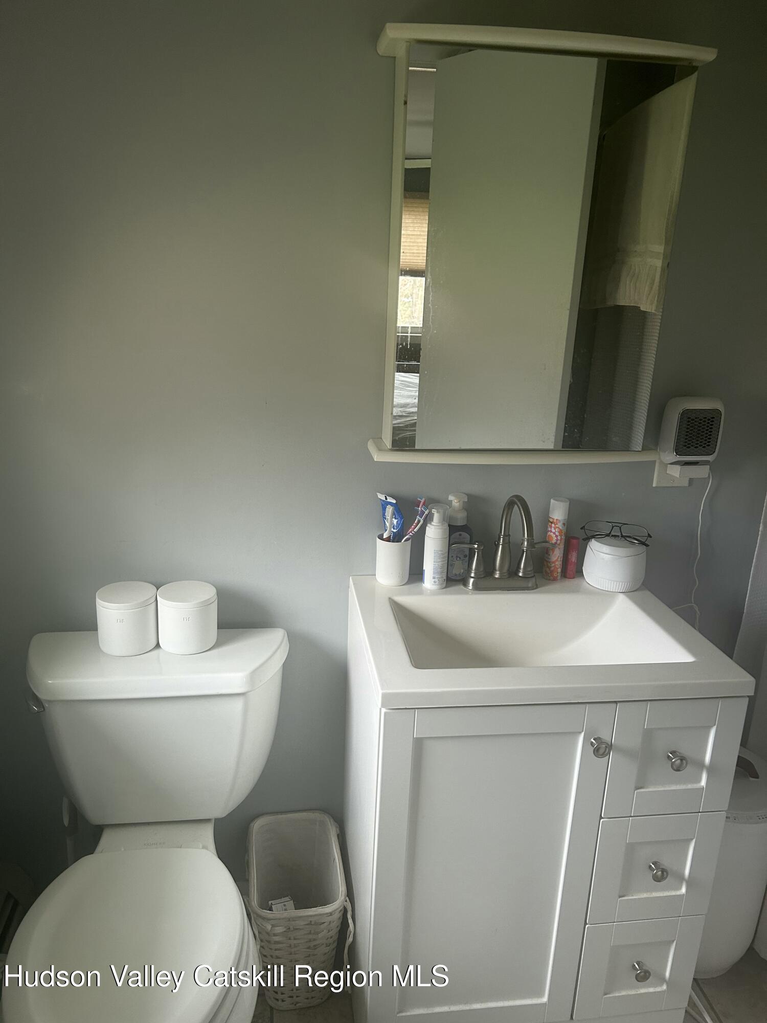 22 Caywood Road Poughkeepsie, NY 12603 - Photo 20 of 27 a white toilet sitting next to a bathroom sink