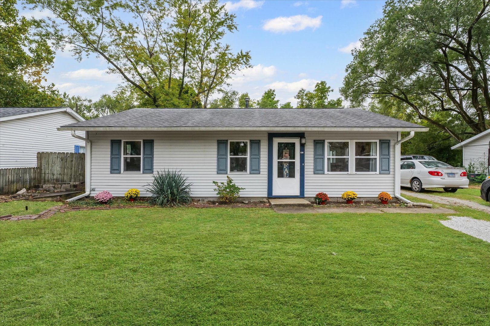 a front view of a house with a garden