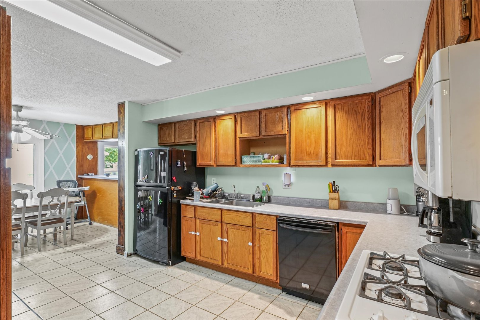 2013 Southwood Drive Champaign, IL 61821 - Photo 11 of 31 a kitchen with stainless steel appliances granite countertop a refrigerator sink and cabinets