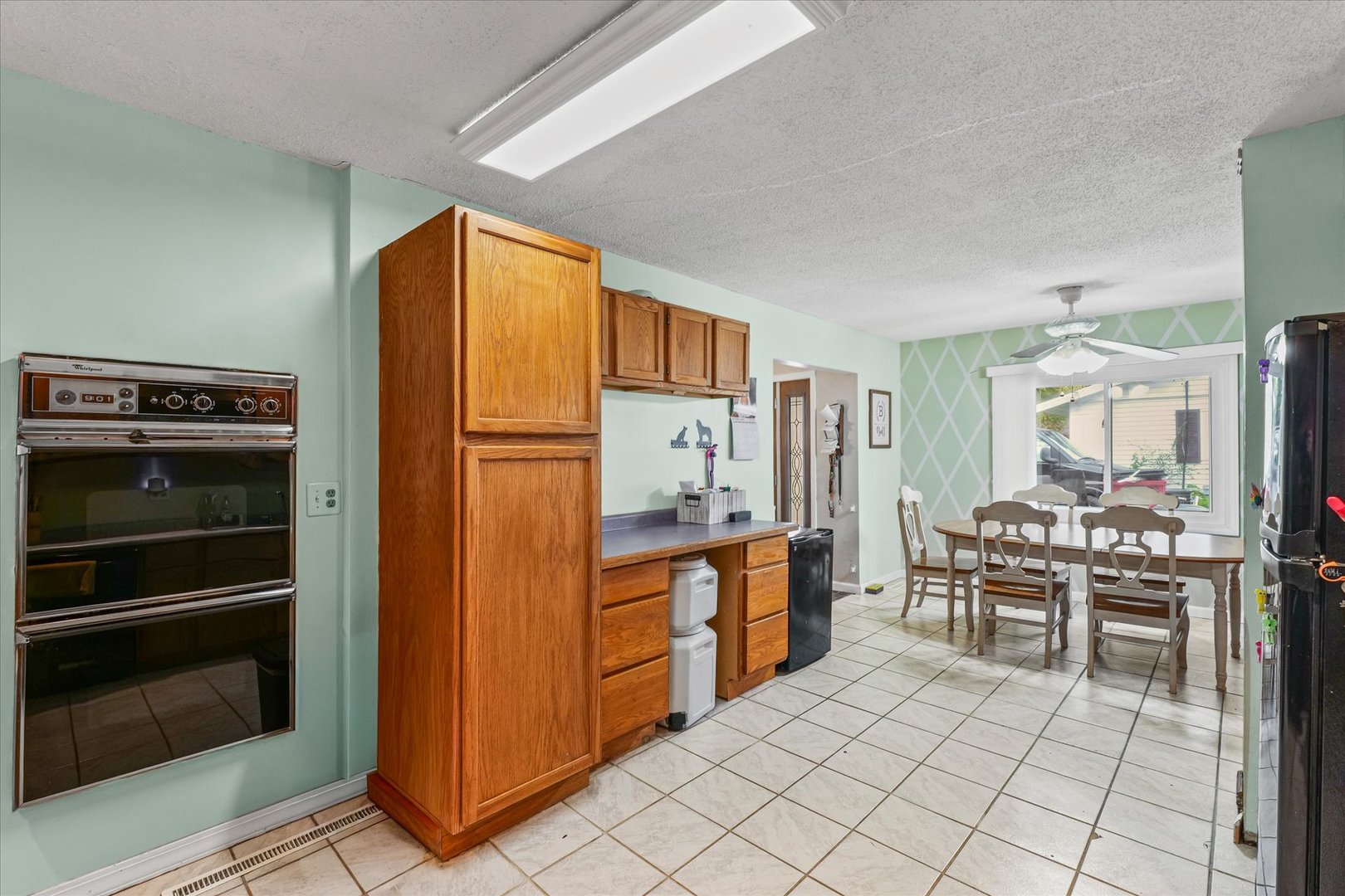 2013 Southwood Drive Champaign, IL 61821 - Photo 12 of 31 a kitchen with stainless steel appliances a stove a refrigerator and cabinets