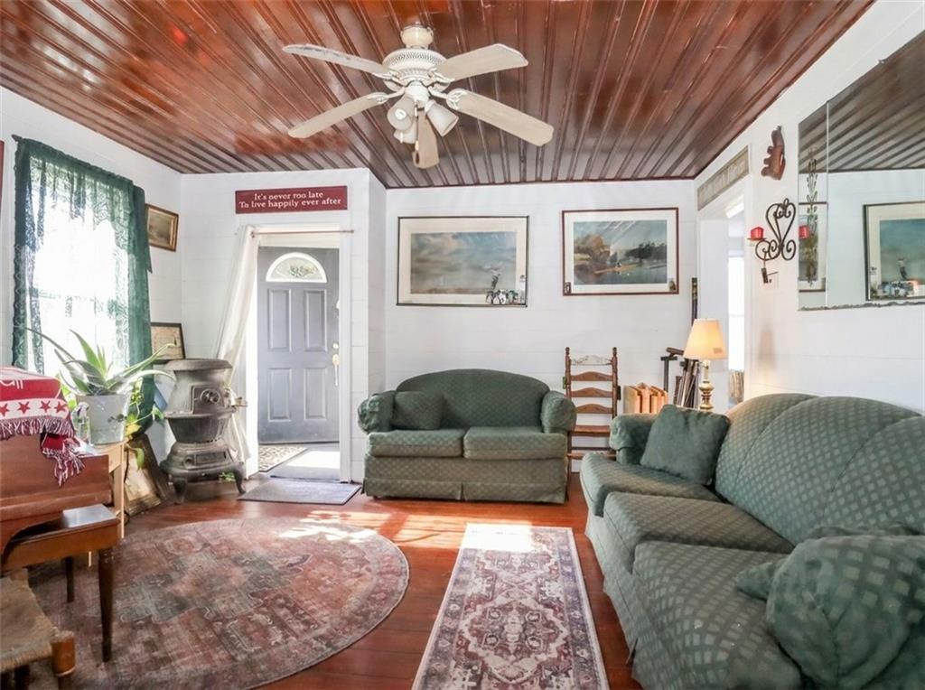 636 Holmdel Road Hazlet, NJ 07730 - Photo 7 of 47 a living room with furniture and a flat screen tv