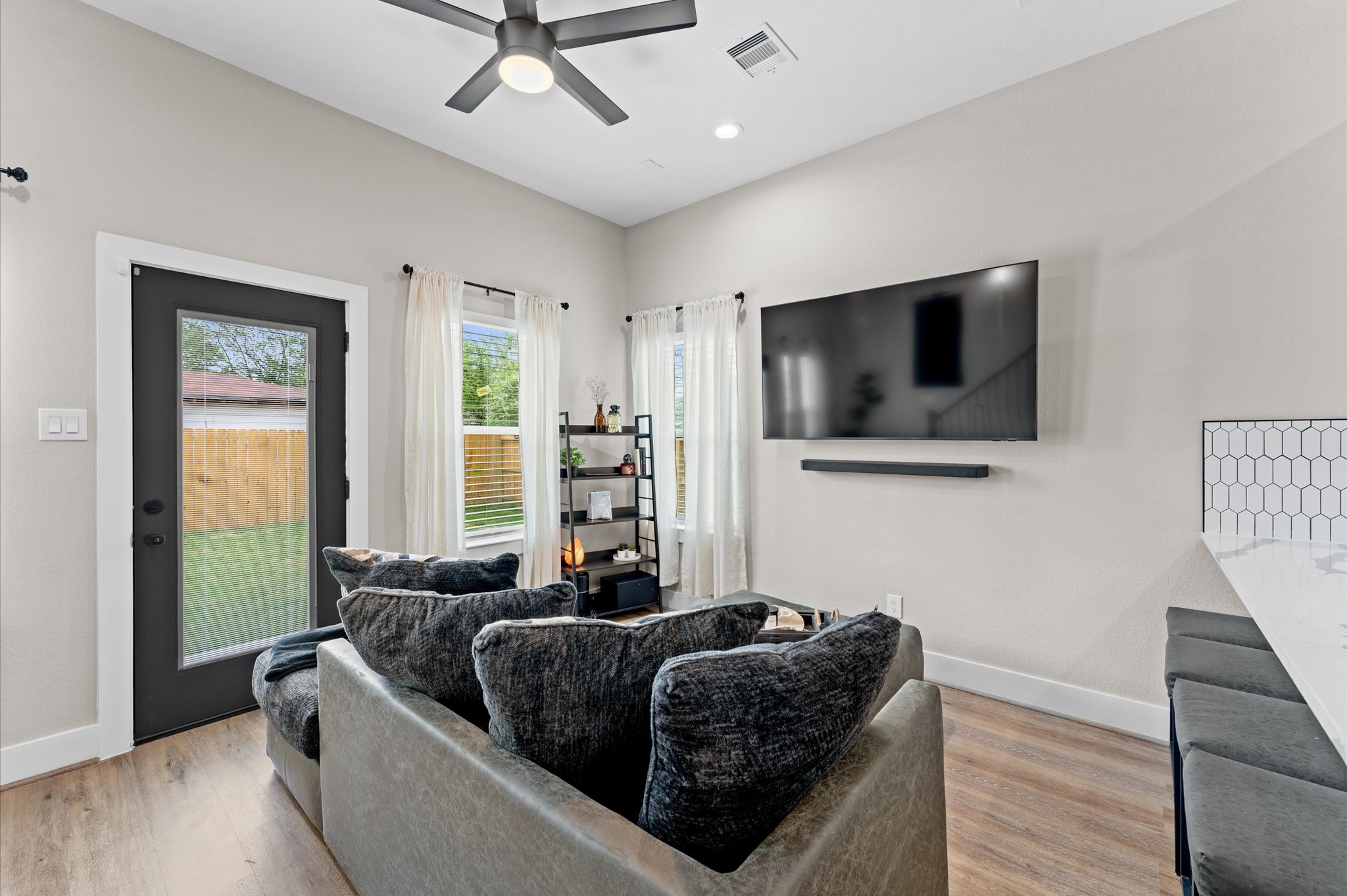 6904 Covington Drive, Unit B Houston, TX 77091 - Photo 14 of 47 a living room with furniture and a flat screen tv