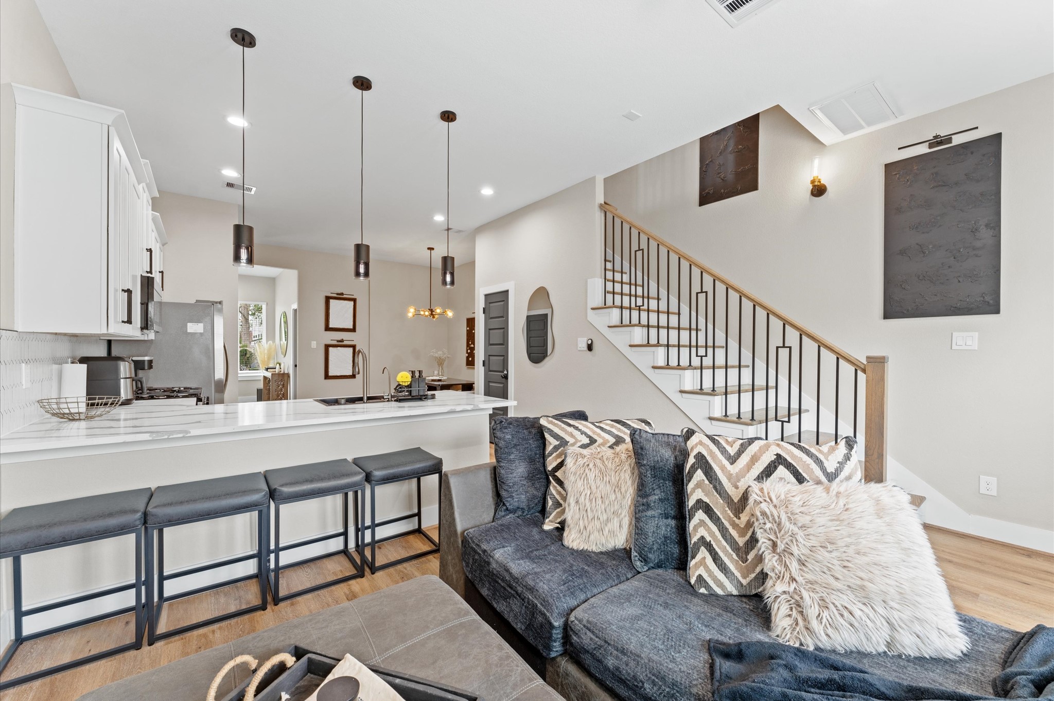 6904 Covington Drive, Unit B Houston, TX 77091 - Photo 16 of 47 a living room with furniture kitchen view and a wooden floor