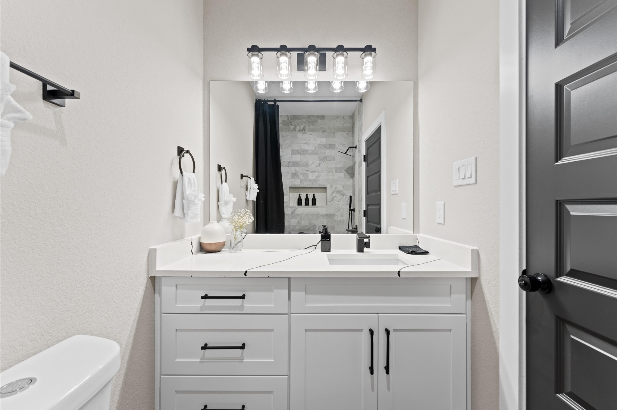 6904 Covington Drive, Unit B Houston, TX 77091 - Photo 26 of 47 a bathroom with a sink vanity granite and a mirror