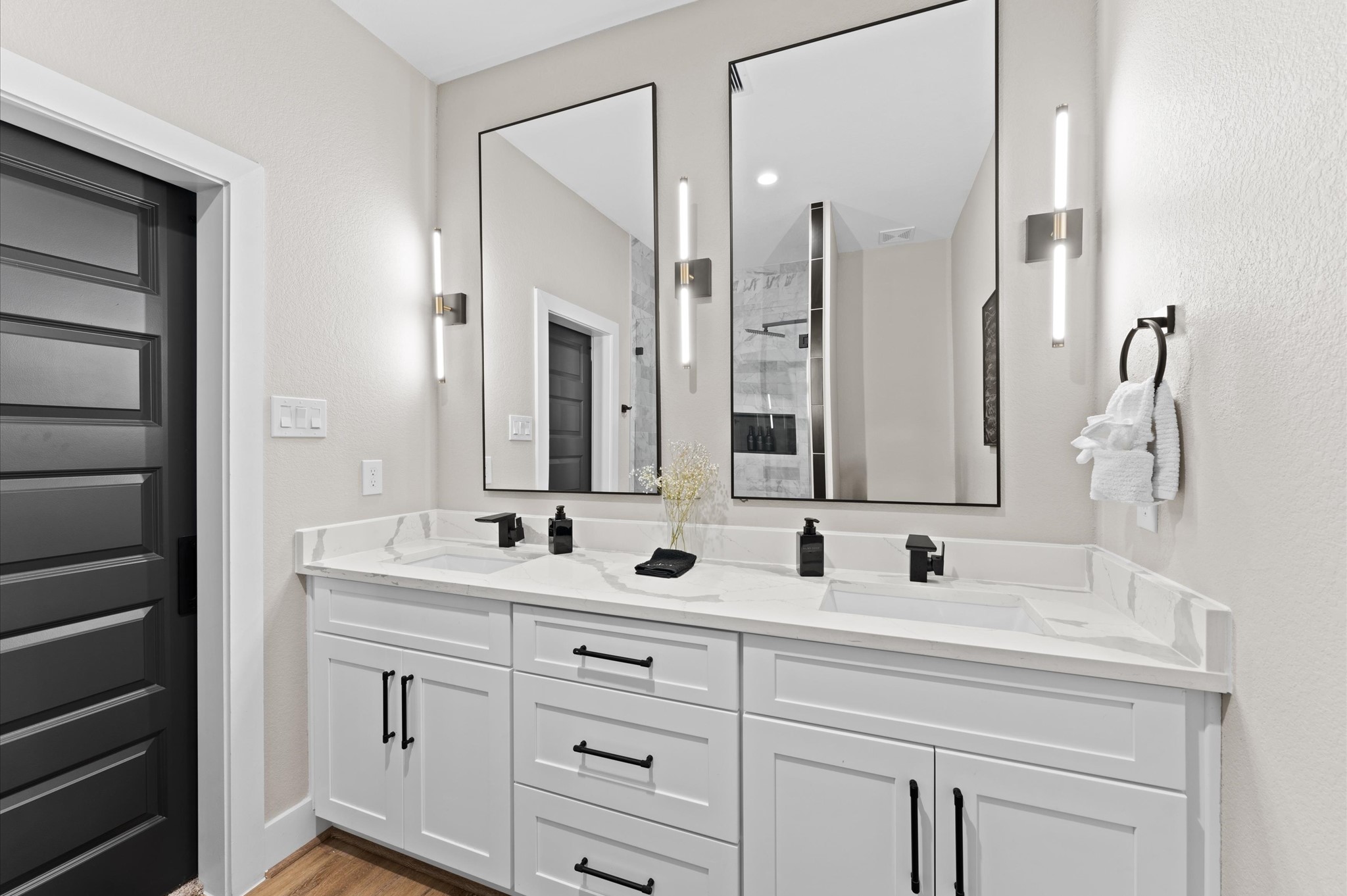 6904 Covington Drive, Unit B Houston, TX 77091 - Photo 32 of 47 a bathroom with double sink and a mirror