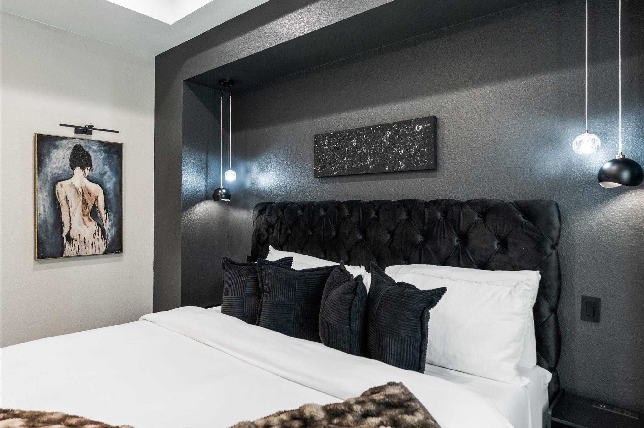 6904 Covington Drive, Unit B Houston, TX 77091 - Photo 41 of 47 a bedroom with a bed and a painting on the wall