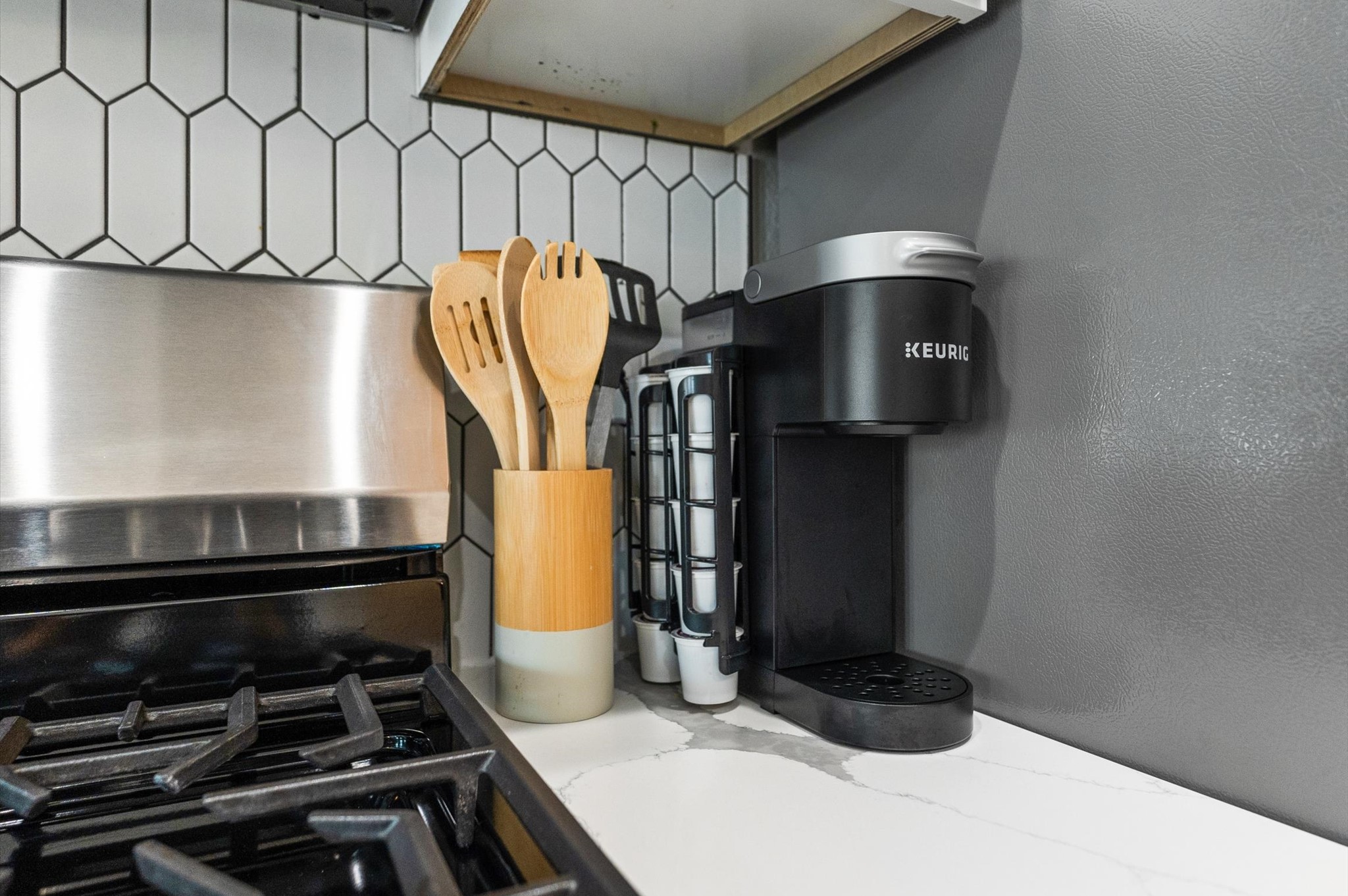 6904 Covington Drive, Unit B Houston, TX 77091 - Photo 45 of 47 a kitchen with a sink and a stove top oven