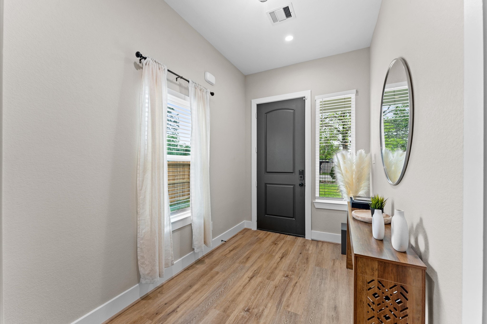 6904 Covington Drive, Unit B Houston, TX 77091 - Photo 6 of 47 a view of a livingroom with furniture window and wooden floor