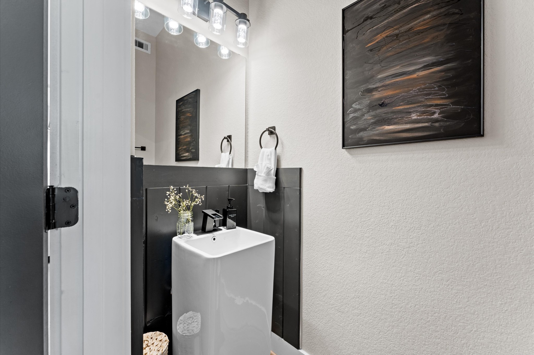 6904 Covington Drive, Unit B Houston, TX 77091 - Photo 10 of 47 a bathroom with a sink and a mirror