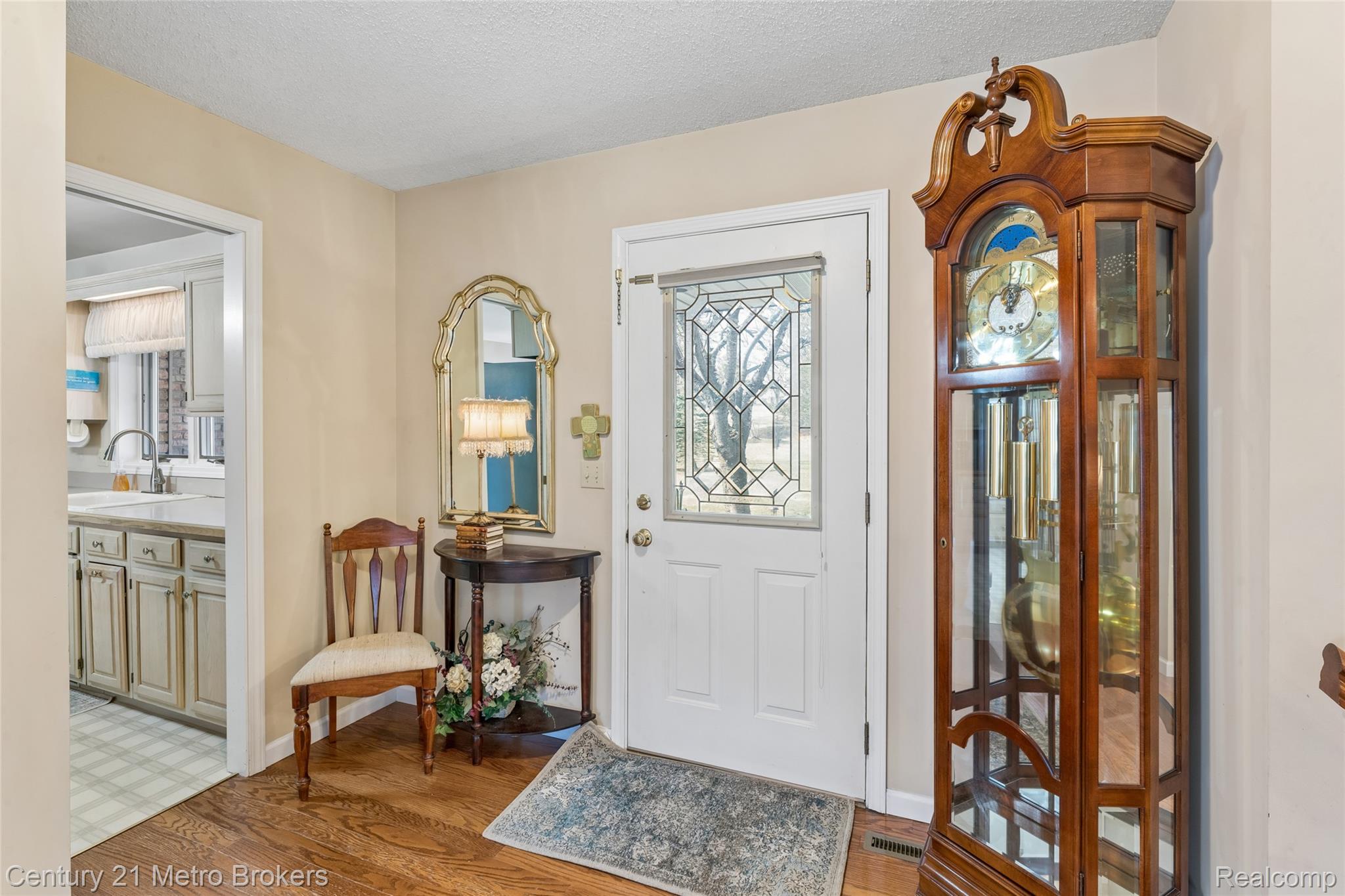 5464 North Seymour Road Flushing, MI 48433 - Photo 12 of 59 Foyer entrance with light wood finished floors and a textured ceiling