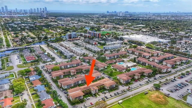 an aerial view of residential houses with city view