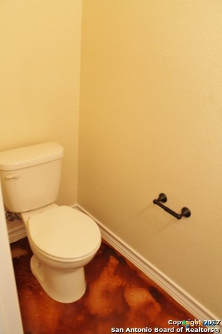 16845 Showdown Path, Unit 2 Selma, TX 78154 - Photo 9 of 16 a bathroom with a toilet and a view