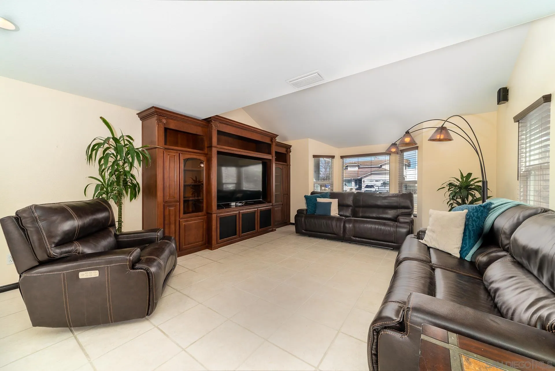 5268 Champlain Street Oceanside, CA 92056 - Photo 19 of 40 a living room with furniture and a flat screen tv