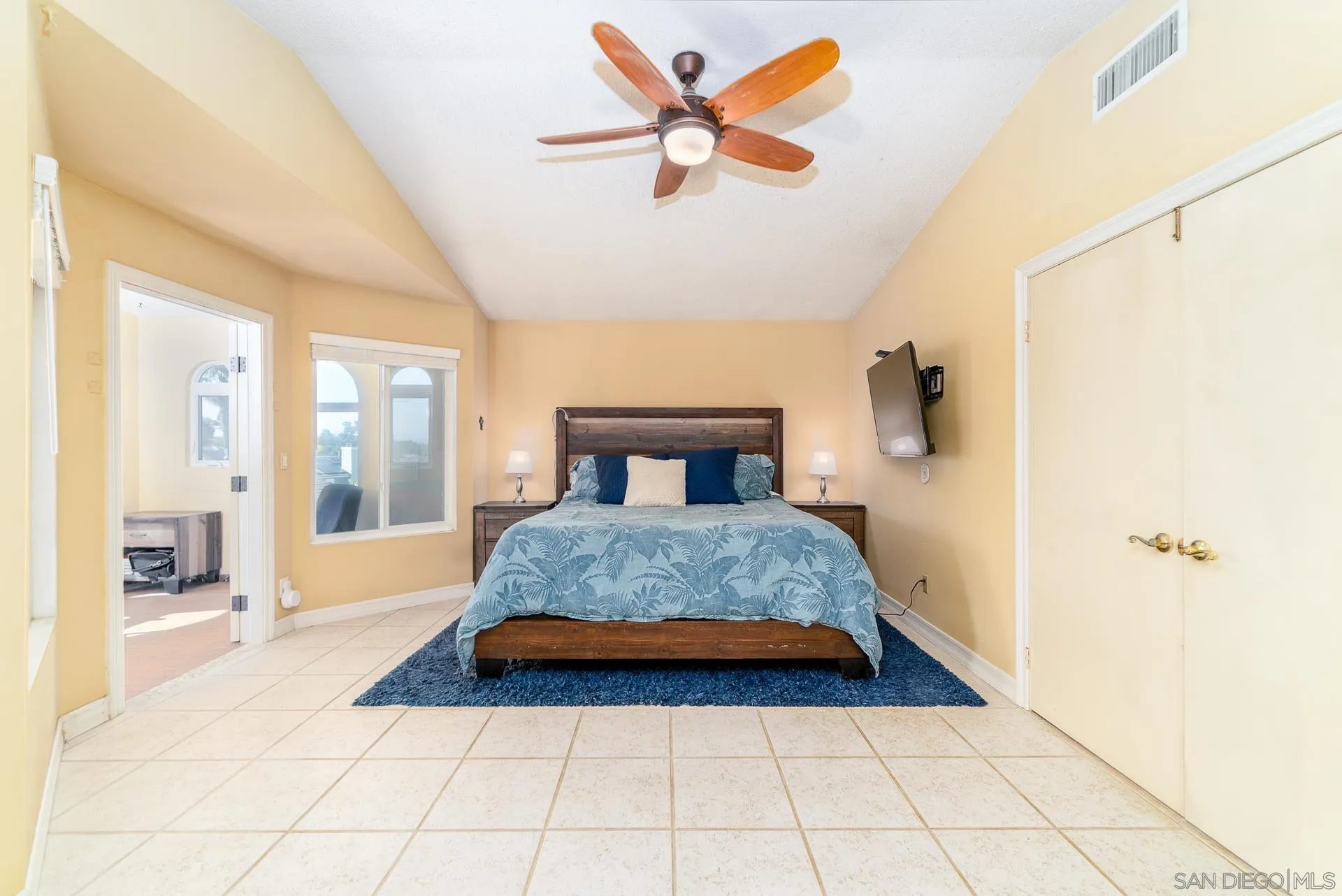 5268 Champlain Street Oceanside, CA 92056 - Photo 20 of 40 a bedroom with a bed and a large window