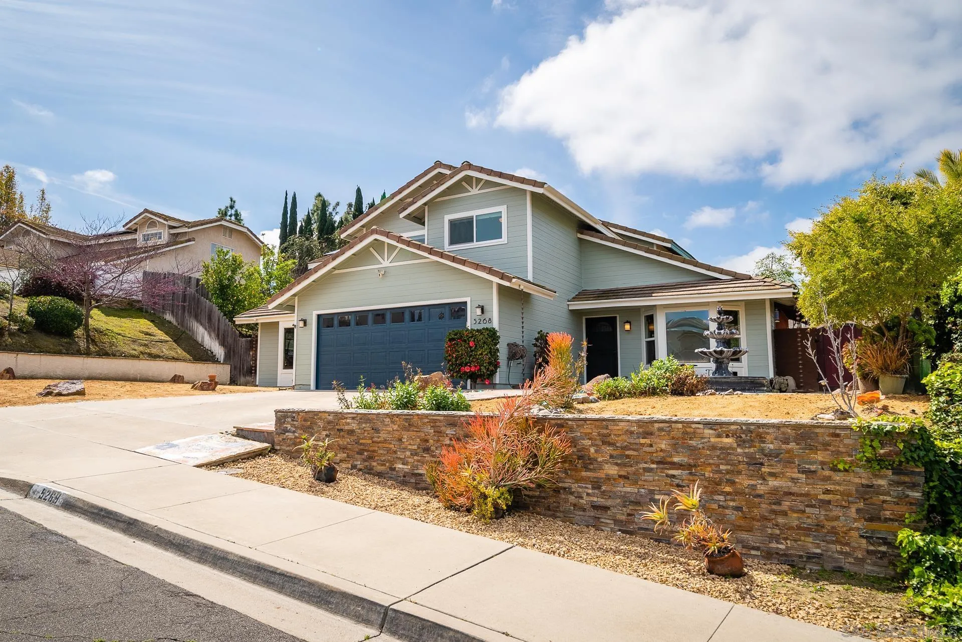 5268 Champlain Street Oceanside, CA 92056 - Photo 2 of 40 a front view of a house with a yard