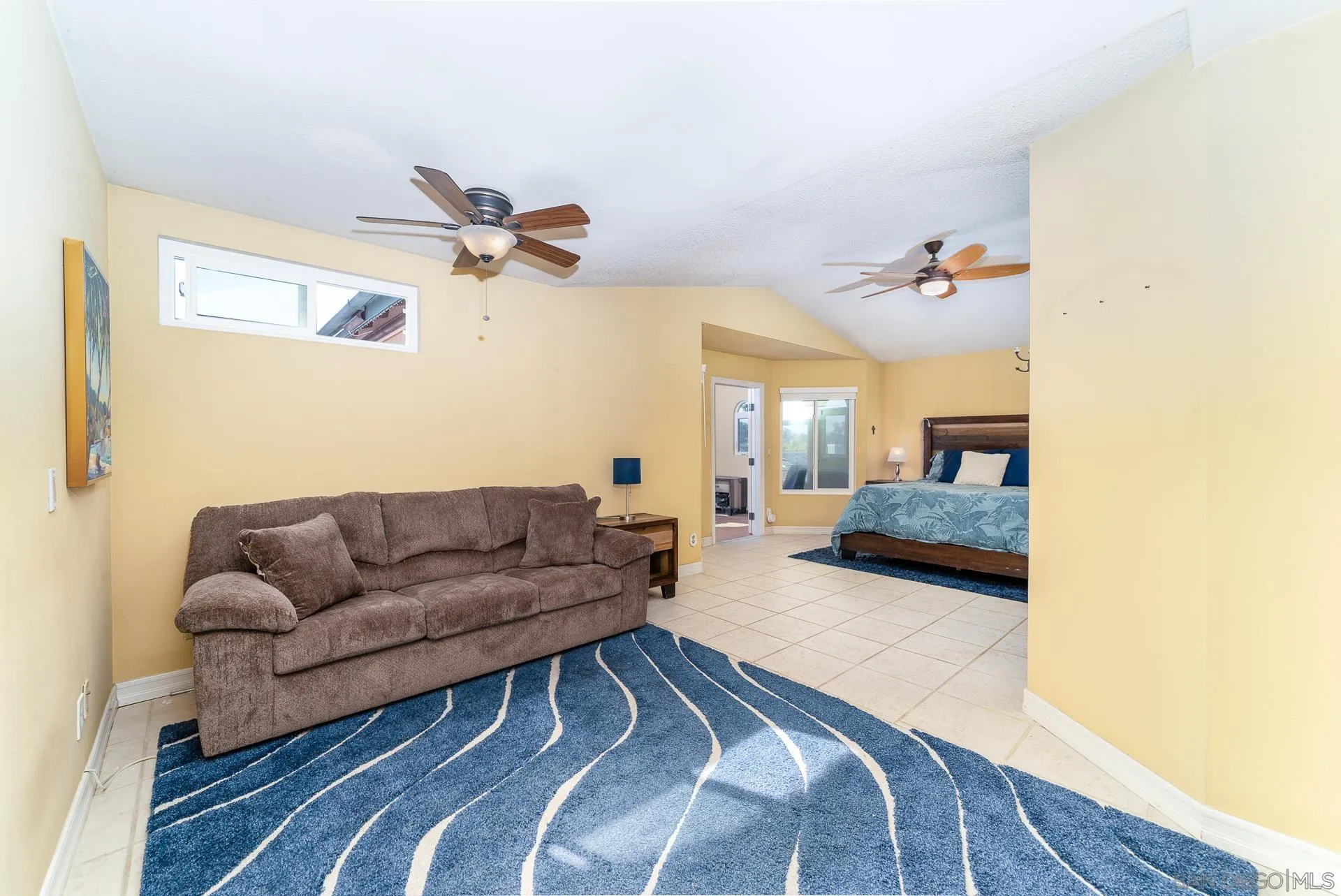 5268 Champlain Street Oceanside, CA 92056 - Photo 21 of 40 a living room with couches and a coffee table