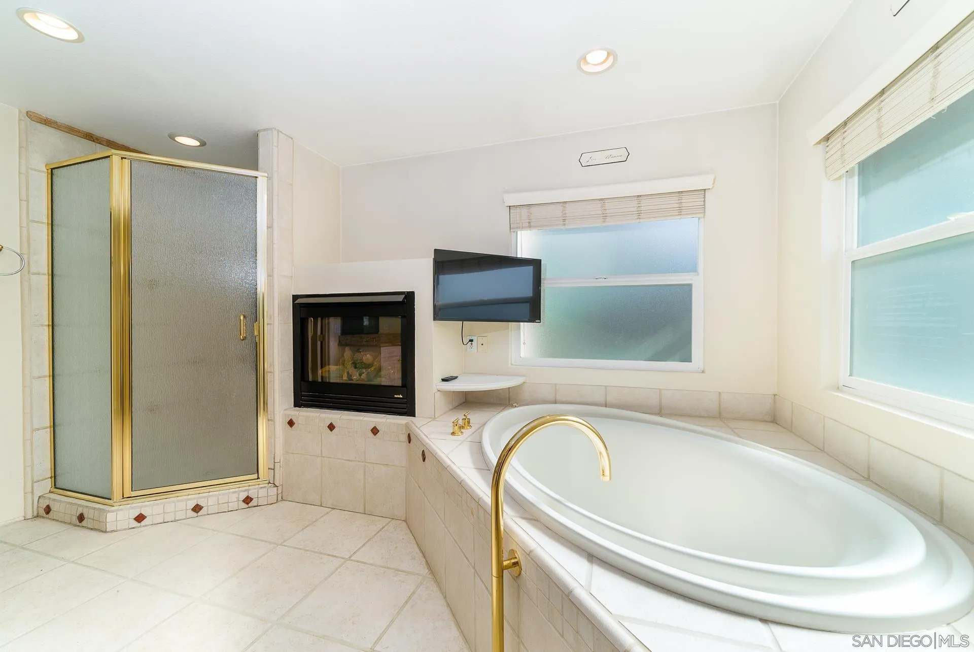 5268 Champlain Street Oceanside, CA 92056 - Photo 24 of 40 a bathroom with a bathtub and a sink