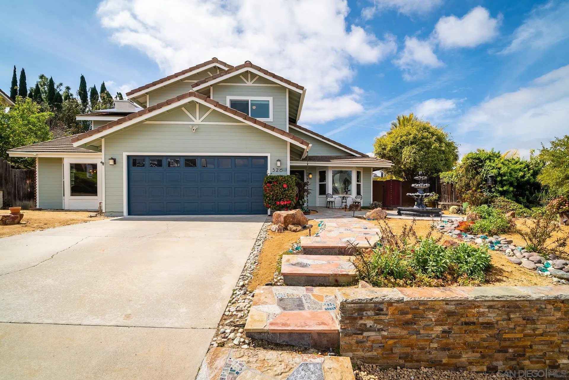 5268 Champlain Street Oceanside, CA 92056 - Photo 3 of 40 a front view of a house with a yard