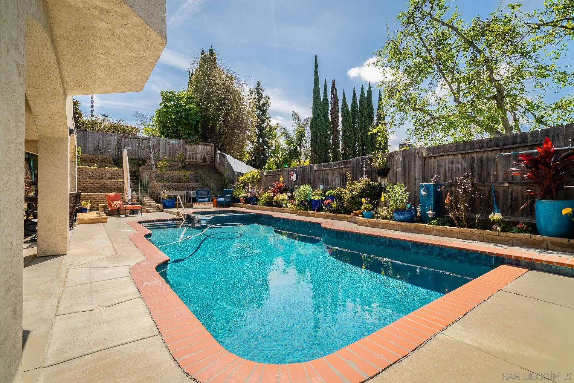 5268 Champlain Street Oceanside, CA 92056 - Photo 34 of 40 a view of a swimming pool with a patio