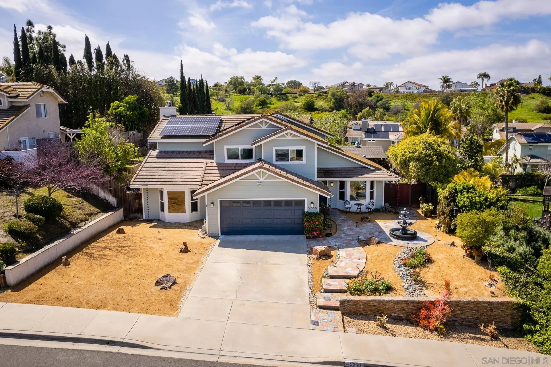 5268 Champlain Street Oceanside, CA 92056 - Photo 4 of 40 a view of a house with a big yard plants and large tree