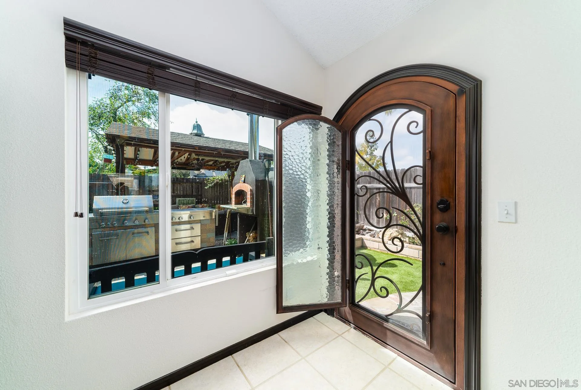 5268 Champlain Street Oceanside, CA 92056 - Photo 9 of 40 a front view of a house with a garden