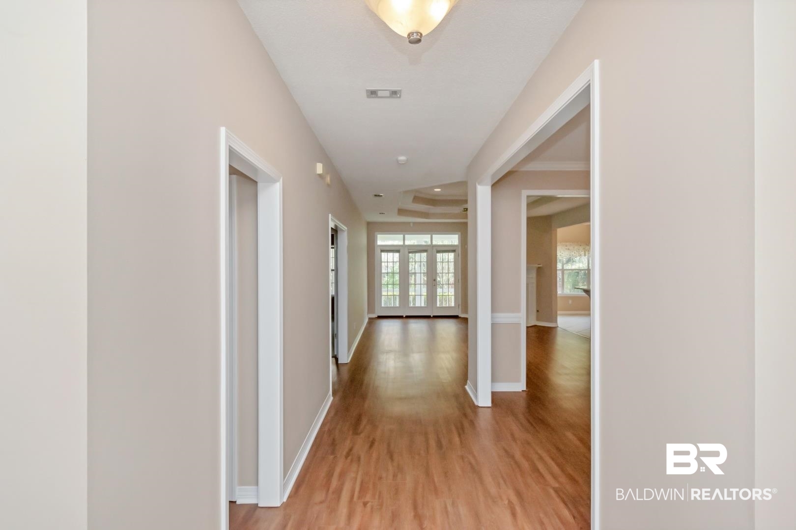 6117 Lennox Place Mobile, AL 36693 - Photo 5 of 39 Corridor with baseboards, light wood finished floors, and visible vents