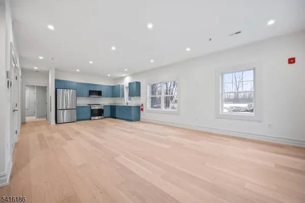 a view of kitchen and a window with furniture