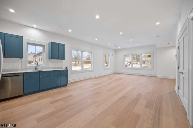 1209 Littleton Road, Unit C Morris Plains, NJ 07950 - Photo 6 of 15 a large kitchen with stainless steel appliances granite countertop a large counter top a sink and a refrigerator