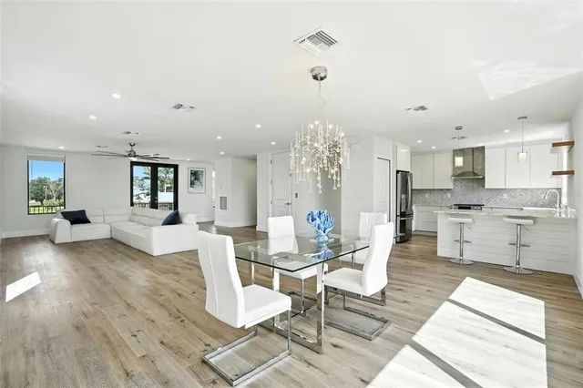 a living room with fireplace furniture and a wooden floor