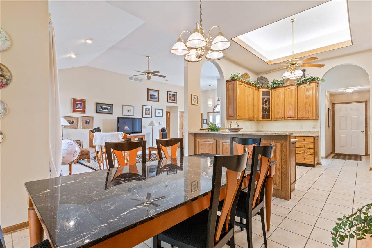 7272 Sentinel Road Rockford, IL 61107 - Photo 12 of 40 a view of a dining room with furniture and chandelier