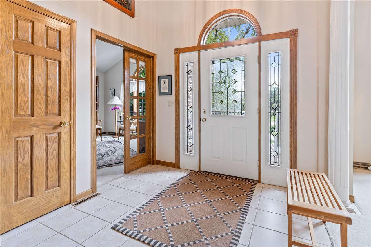 7272 Sentinel Road Rockford, IL 61107 - Photo 23 of 40 a view of entryway with wooden floor and windows