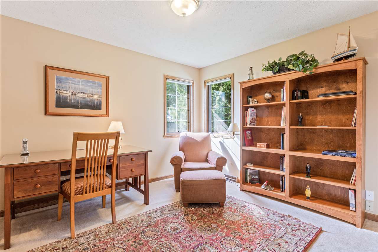7272 Sentinel Road Rockford, IL 61107 - Photo 28 of 40 a living room with furniture a lamp and a window