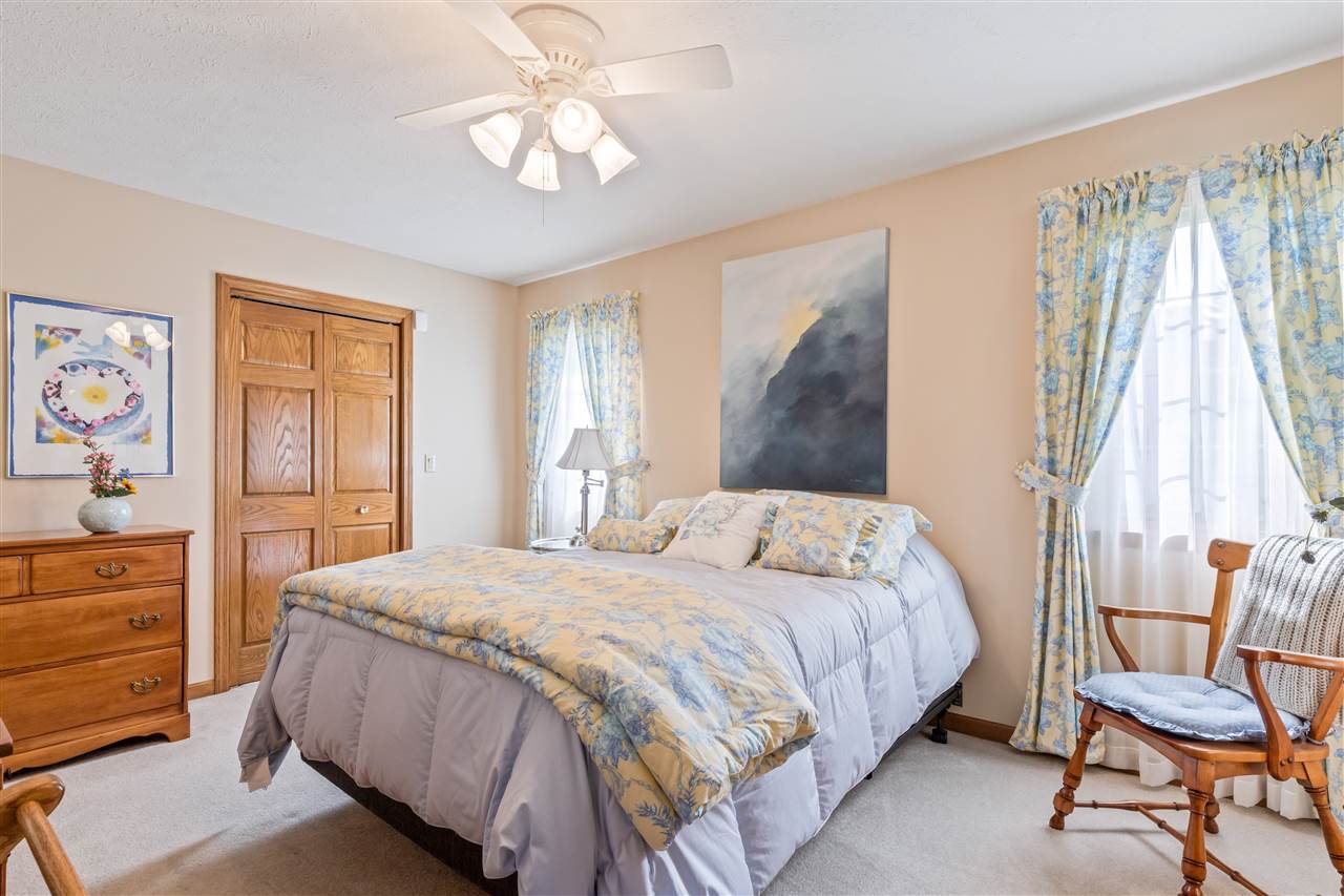 7272 Sentinel Road Rockford, IL 61107 - Photo 29 of 40 a bedroom with a bed and chair