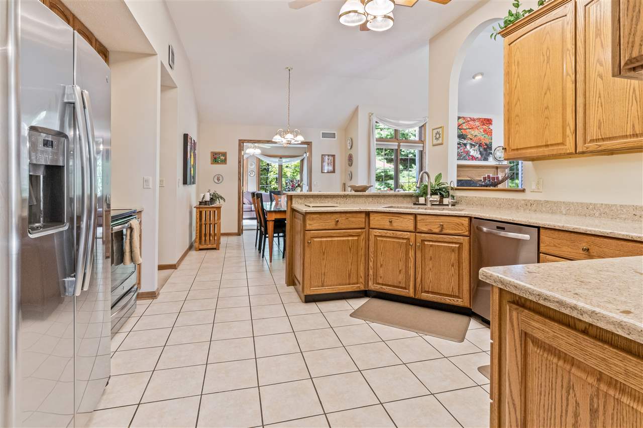 7272 Sentinel Road Rockford, IL 61107 - Photo 7 of 40 a kitchen with stainless steel appliances a sink counter space and a window