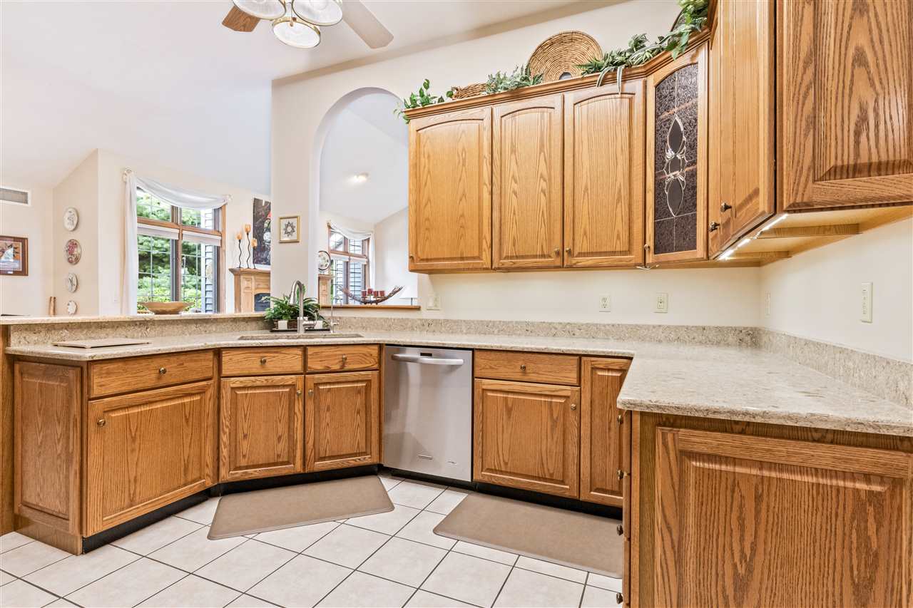 7272 Sentinel Road Rockford, IL 61107 - Photo 8 of 40 a kitchen with stainless steel appliances granite countertop a sink a stove cabinets and a window