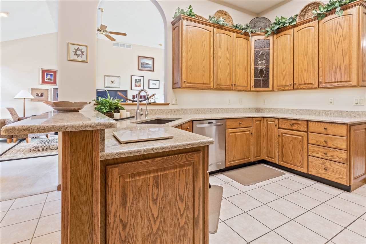 7272 Sentinel Road Rockford, IL 61107 - Photo 10 of 40 a kitchen with a sink a stove and cabinets