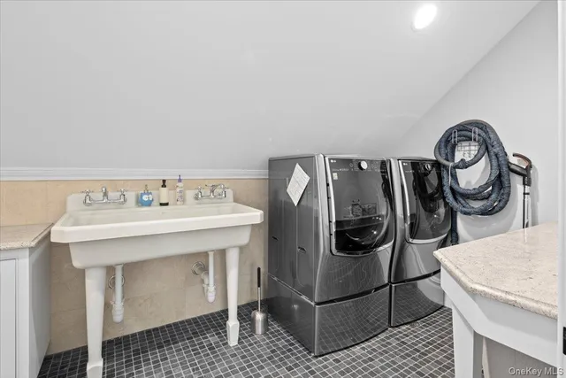 a utility room with dryer and washer