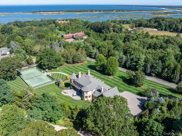 an aerial view of a house with outdoor space