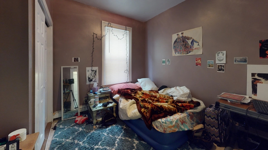 36 Mozart Street, Unit 2 Boston, MA 02130 - Photo 4 of 9 a bed room with a bed and a window