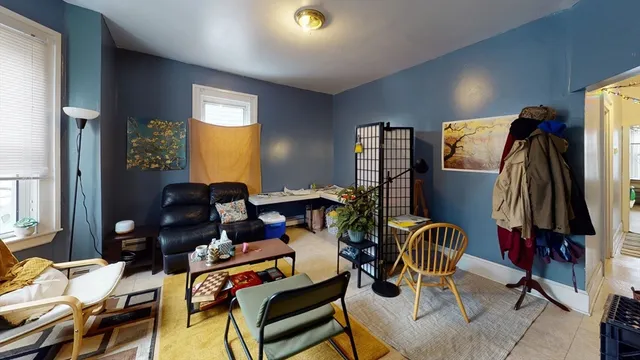 a living room with furniture and a closet